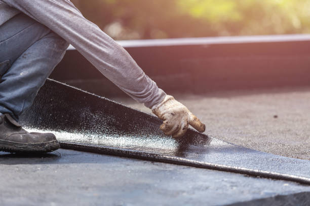 Professional Basement Waterproofing technician working in Levittown, NY